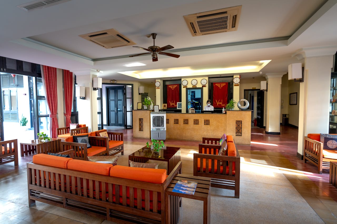 our-experience Inviting hotel reception with a warm, contemporary design and vibrant seating.